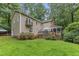 Home featuring a spacious deck, screened porch, and lush greenery for outdoor enjoyment at 5805 Bayberry Ln, Raleigh, NC 27612