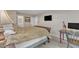 Comfortable bedroom with a decorative lamp, desk, and TV at 5805 Bayberry Ln, Raleigh, NC 27612