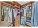Walk-in closet with custom shelving and ample storage space for clothes and accessories at 5805 Bayberry Ln, Raleigh, NC 27612