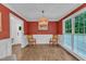 Charming dining room with hardwood floors, a decorative pendant light, and large window overlooking greenery at 5805 Bayberry Ln, Raleigh, NC 27612
