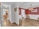 Elegant dining room with hardwood floors, wainscoting, and a decorative pendant light fixture at 5805 Bayberry Ln, Raleigh, NC 27612
