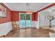 Inviting dining room with hardwood floors, chair railing, and a decorative pendant light fixture at 5805 Bayberry Ln, Raleigh, NC 27612