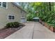 Wide driveway leads to a spacious garage, complemented by a charming water feature at 5805 Bayberry Ln, Raleigh, NC 27612