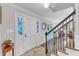 Welcoming foyer with a decorative glass front door, staircase, and hardwood floors at 5805 Bayberry Ln, Raleigh, NC 27612