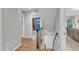 Hallway featuring hardwood floors, stairs and entry to bedroom with colorful decorations at 5805 Bayberry Ln, Raleigh, NC 27612