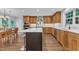 Spacious kitchen with a center island, stainless appliances, lots of cabinets, and hardwood floors at 5805 Bayberry Ln, Raleigh, NC 27612