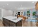 Kitchen and breakfast nook with granite counters, stainless steel appliances and seating at the island at 5805 Bayberry Ln, Raleigh, NC 27612