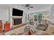 Welcoming living room features a fireplace, glass doors and backyard view at 5805 Bayberry Ln, Raleigh, NC 27612