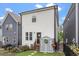 Charming backyard with shed, small porch, black fence, and stepping stone path to the rear door at 586 Great Ridge Pkwy, Chapel Hill, NC 27517