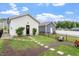 Beautiful backyard featuring lush green grass, stepping stones, and a black aluminum fence at 586 Great Ridge Pkwy, Chapel Hill, NC 27517