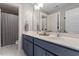 Bathroom with double sinks, shaker cabinets, and a mirror at 586 Great Ridge Pkwy, Chapel Hill, NC 27517