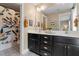 Bathroom featuring double sinks with shaker cabinets, decorative mirrors, and shower at 586 Great Ridge Pkwy, Chapel Hill, NC 27517