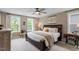 Bedroom with natural lighting, windows, ceiling fan, and furnishings at 586 Great Ridge Pkwy, Chapel Hill, NC 27517