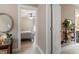 Serene bedroom view through doorway, showcasing natural light and soothing color palette at 586 Great Ridge Pkwy, Chapel Hill, NC 27517