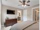 Bedroom featuring a dresser, television, and ensuite bathroom at 586 Great Ridge Pkwy, Chapel Hill, NC 27517