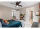Bedroom with ceiling fan and access to the bathroom and a closet at 586 Great Ridge Pkwy, Chapel Hill, NC 27517