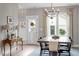 Cozy dining room with wood table, modern chandelier, and neutral decor at 586 Great Ridge Pkwy, Chapel Hill, NC 27517
