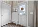 Functional entryway featuring storage, bench seating, and a stylish door at 586 Great Ridge Pkwy, Chapel Hill, NC 27517