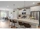 Bright, open kitchen features a large island, stainless steel appliances, and eat-in dining area at 586 Great Ridge Pkwy, Chapel Hill, NC 27517