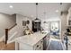 Well-equipped kitchen with island, stainless steel appliances, and open layout to dining area at 586 Great Ridge Pkwy, Chapel Hill, NC 27517