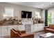 Open-concept living space with modern finishes, sleek lighting, and a seamless flow into the kitchen area at 586 Great Ridge Pkwy, Chapel Hill, NC 27517
