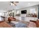 Open-concept living space with modern finishes, sleek lighting, and a seamless flow into the kitchen area at 586 Great Ridge Pkwy, Chapel Hill, NC 27517