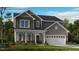 Charming two-story home featuring a covered porch and a two-car garage at 618 Contento Ct, Sanford, NC 27330