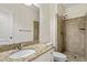 Bathroom with a granite countertop, white cabinets and tiled shower at 6217 Battleford Dr, Raleigh, NC 27612