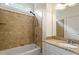 Bathroom features a tiled shower and tub combination, granite countertop, and neutral finishes at 6217 Battleford Dr, Raleigh, NC 27612