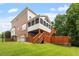 Back exterior view of home and its multi-level deck and walkout basement to a fenced in yard at 6217 Battleford Dr, Raleigh, NC 27612