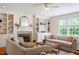 Inviting living room with a fireplace, built-in shelves, and comfortable seating at 6217 Battleford Dr, Raleigh, NC 27612