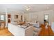 Spacious living room with hardwood floors, stylish furniture, and views to other rooms at 6217 Battleford Dr, Raleigh, NC 27612