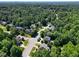 Aerial view of the neighborhood and surrounding forest at 6217 Battleford Dr, Raleigh, NC 27612