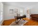 Bright office with hardwood floors, a modern desk, and built-in bookshelves at 6217 Battleford Dr, Raleigh, NC 27612