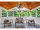 Bright sunroom with vaulted ceiling, fan, and large windows providing a view of the backyard at 6217 Battleford Dr, Raleigh, NC 27612