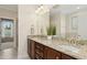 Bathroom features a double vanity with granite countertop and wood cabinets at 6444 Kit Creek Rd, Morrisville, NC 27560