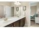 Bathroom featuring a double vanity and view of a bedroom at 6444 Kit Creek Rd, Morrisville, NC 27560