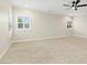 Bright bonus room featuring a ceiling fan, carpeted floor and natural lighting from several windows at 6444 Kit Creek Rd, Morrisville, NC 27560