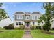 Charming two-story home featuring a well-maintained lawn and inviting facade with stone and landscaped entryway at 6444 Kit Creek Rd, Morrisville, NC 27560