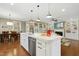 Kitchen island with marble countertop, sink, and stainless steel dishwasher at 6444 Kit Creek Rd, Morrisville, NC 27560