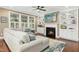 Cozy living room features a fireplace, built-in shelving, and large windows at 6444 Kit Creek Rd, Morrisville, NC 27560