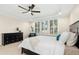 Main bedroom with tray ceiling, carpeted floors, and plantation shutters at 6444 Kit Creek Rd, Morrisville, NC 27560