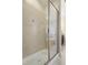Walk-in shower features tile surround, glass door, and neutral color palette at 6444 Kit Creek Rd, Morrisville, NC 27560