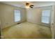 A quaint bedroom with neutral walls and a ceiling fan at 65 Opie Frazier Rd, Henderson, NC 27537