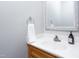 Well-maintained bathroom with a clean white sink, faucet, and a decorative towel ring at 657 Lakeview Dr, Stem, NC 27581