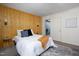 Comfortable bedroom with accent wall, plush bedding, and a closet view at 657 Lakeview Dr, Stem, NC 27581