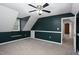 Large bedroom with angled ceilings, a ceiling fan, neutral carpet, and two-tone paint at 657 Lakeview Dr, Stem, NC 27581