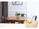 Cozy dining area featuring a round wooden table with black metal chairs and stylish decor at 657 Lakeview Dr, Stem, NC 27581