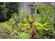 A colorful garden featuring a variety of plants and flowers, showcasing the property's landscape at 657 Lakeview Dr, Stem, NC 27581