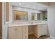 Bathroom featuring double sinks, large mirrors, and tiled floors at 69 Margaret Pl, Chapel Hill, NC 27516